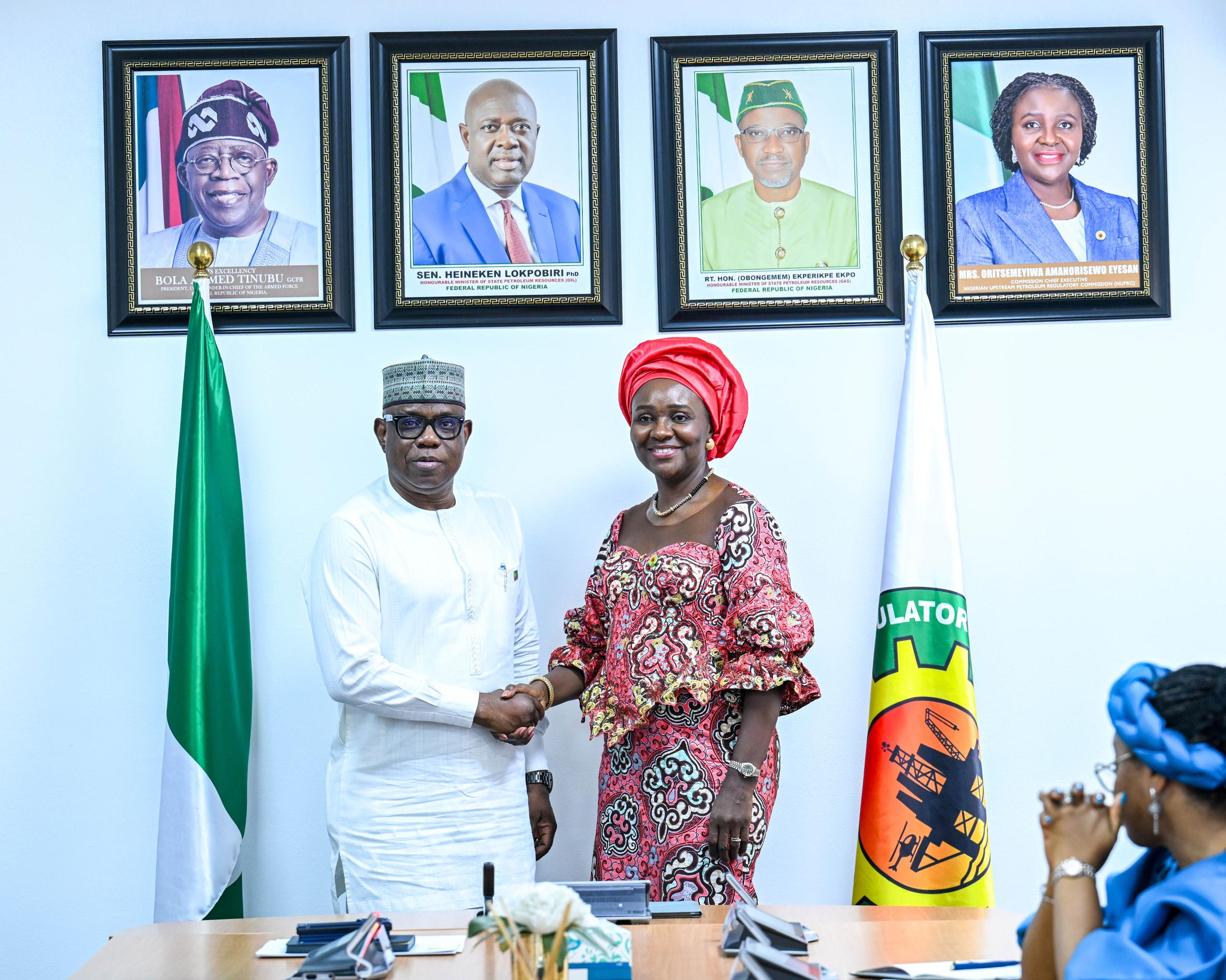 NNPC Group Chief Executive Officer, Bayo Ojulari and NUPRC Chief Executive, Oritsemeyiwa Eyesan.