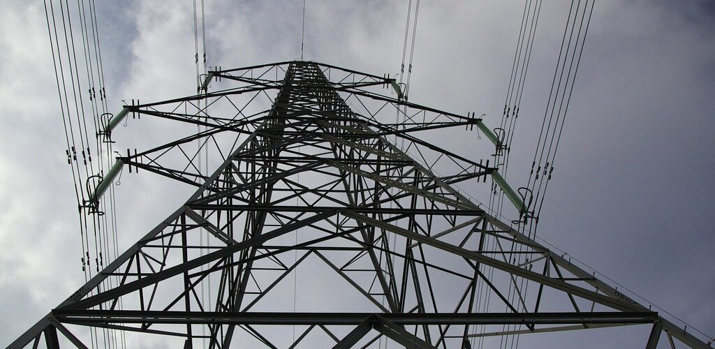 A transmission tower [PHOTO CREDIT: Ellesmere Port Cheshire https://www flickr com/photos/oneterry/15143973918]