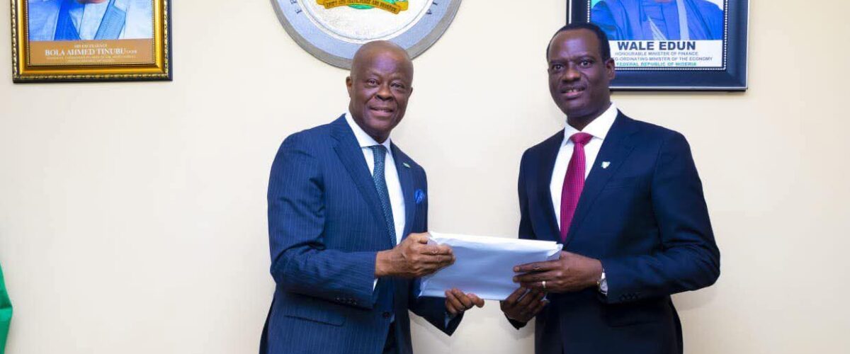 Mr Edun handing over the baton of office to Mr Oyedele 