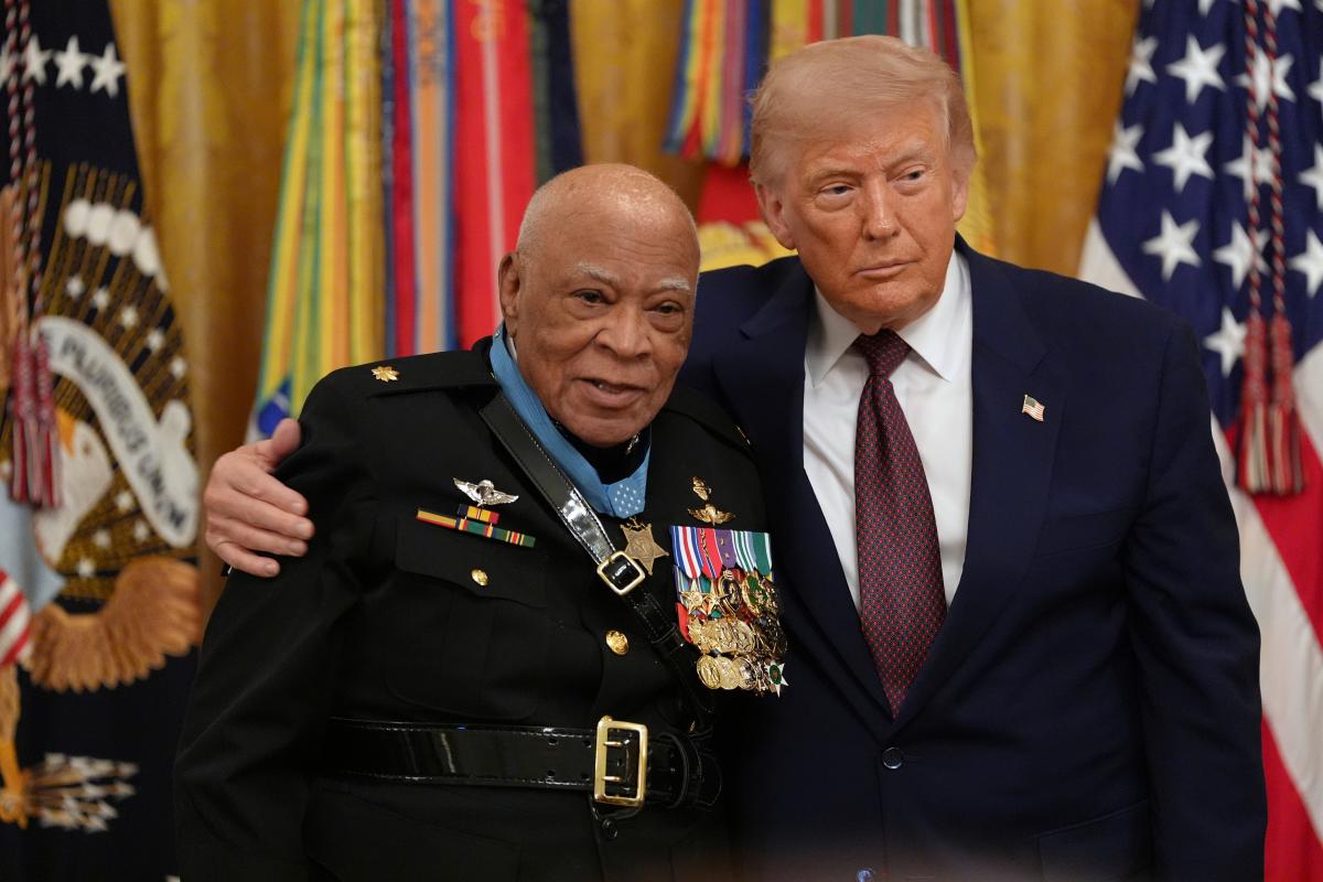 Major James Capers Jr is presented the Medal of Honor by Mr Trump during a Medal of Honour Ceremony on Thursday (Credit: AP photo)