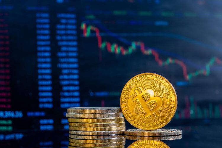 Closeup golden bitcoins dark reflective surface histogram decreasing crypto scaled 1