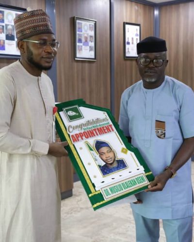 L-R: NERC Chairman, Musiliu Oseni, and PCAN Chairman, Obas Esiedesa.