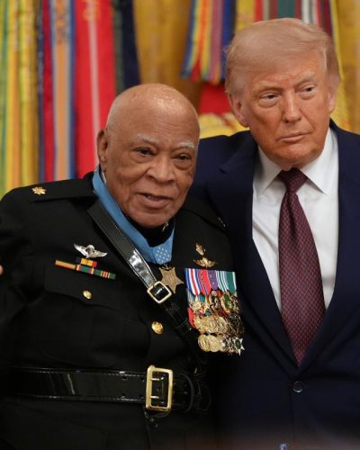 Major James Capers Jr. is presented the Medal of Honor by Mr Trump during a Medal of Honour Ceremony on Thursday. (Credit: AP photo)